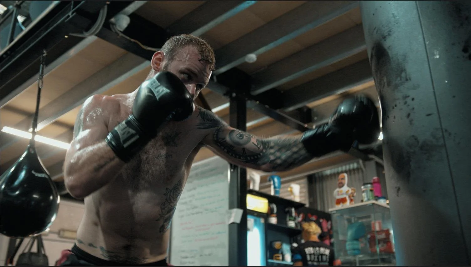 Pad work on the BoxCamp gym floor